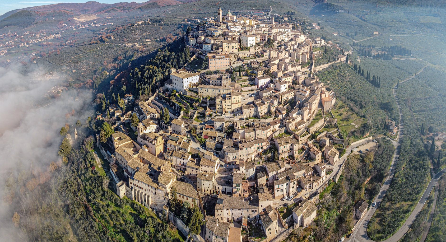 aerial view of ancient san marino city on lush hill